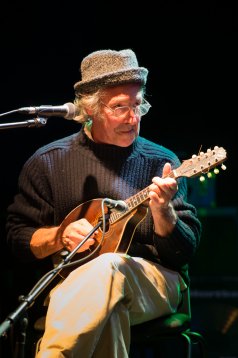 Pete Brazier playing mandolin, wearing hat